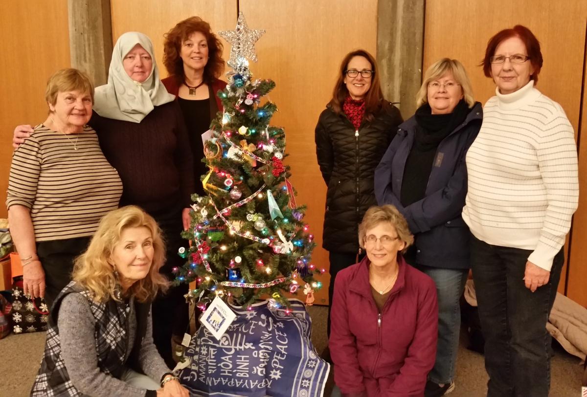 Donating a Christmas tree with interfaith symbols for the Everson Festival of Trees