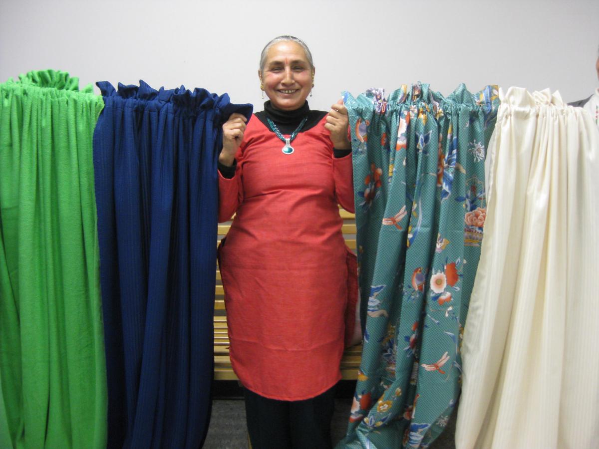 One sewing class graduate makes curtains for new arrivals